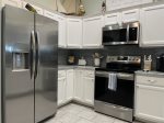 All white custom cabinets and full size appliances